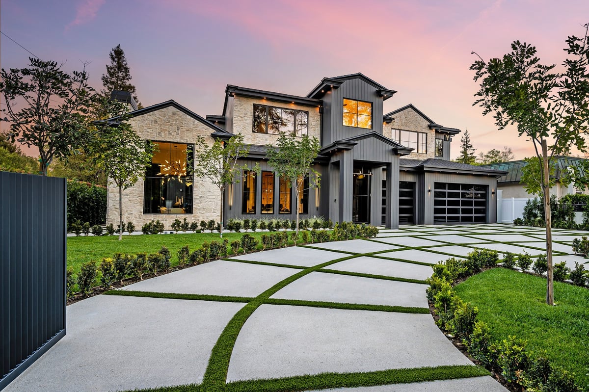 Fully restored modern home exterior with manicured lawn