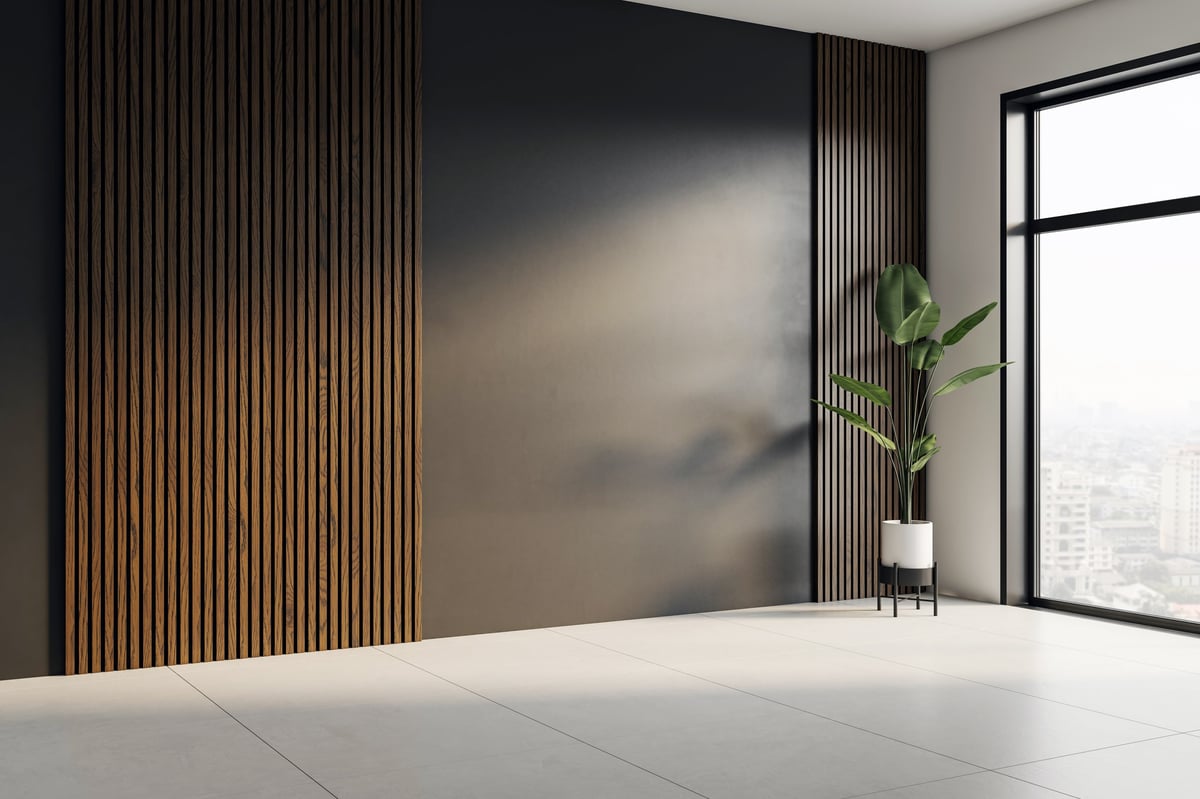 Modern interior corner with dark blank wall and vertical wood slats, large window with city view, light tiled floor and potted plant. 3D Rendering