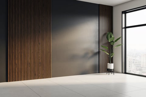 Modern interior corner with dark blank wall and vertical wood slats, large window with city view, light tiled floor and potted plant. 3D Rendering
