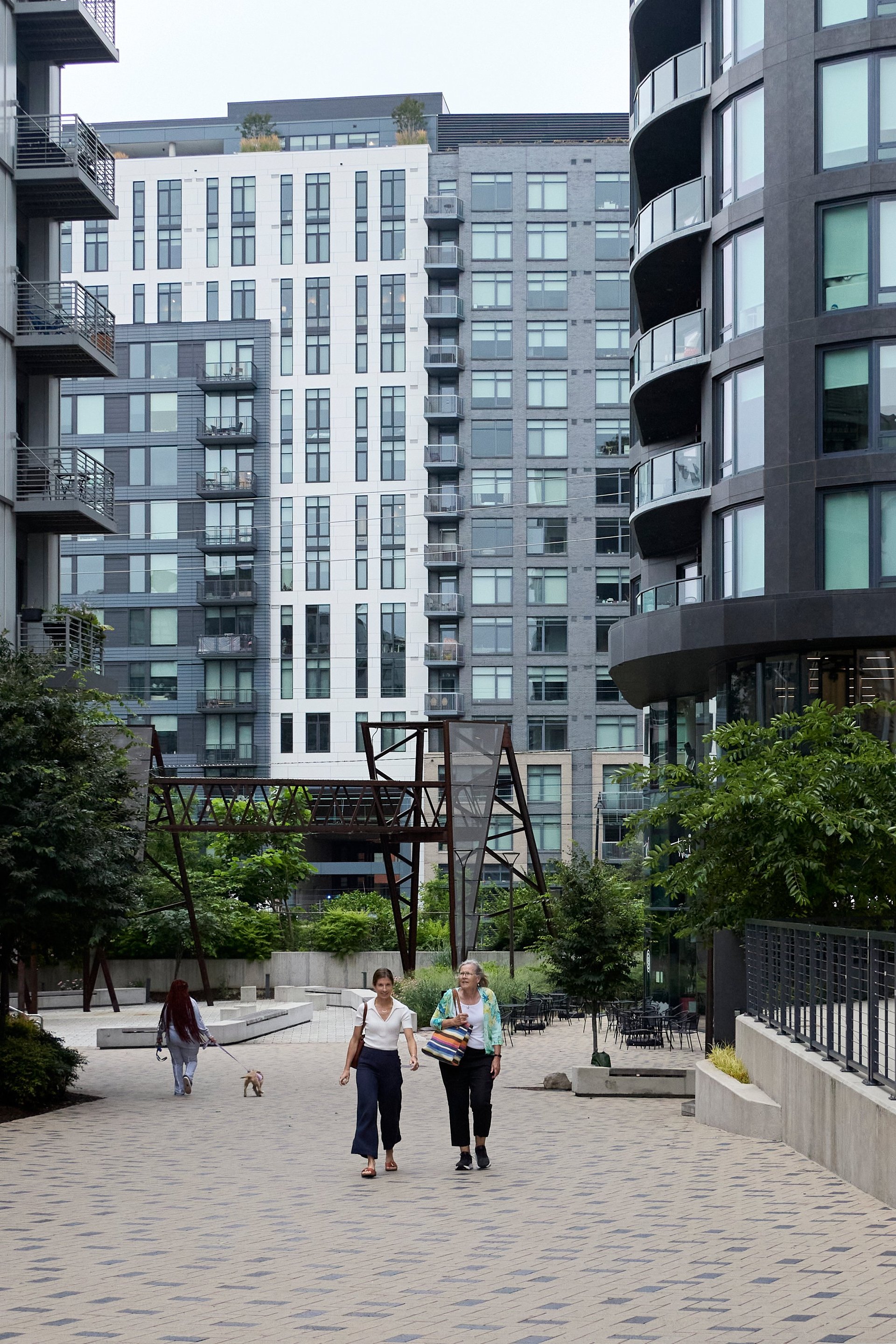 Courtyard and shared green space between residential apartment buildings in a maintained community