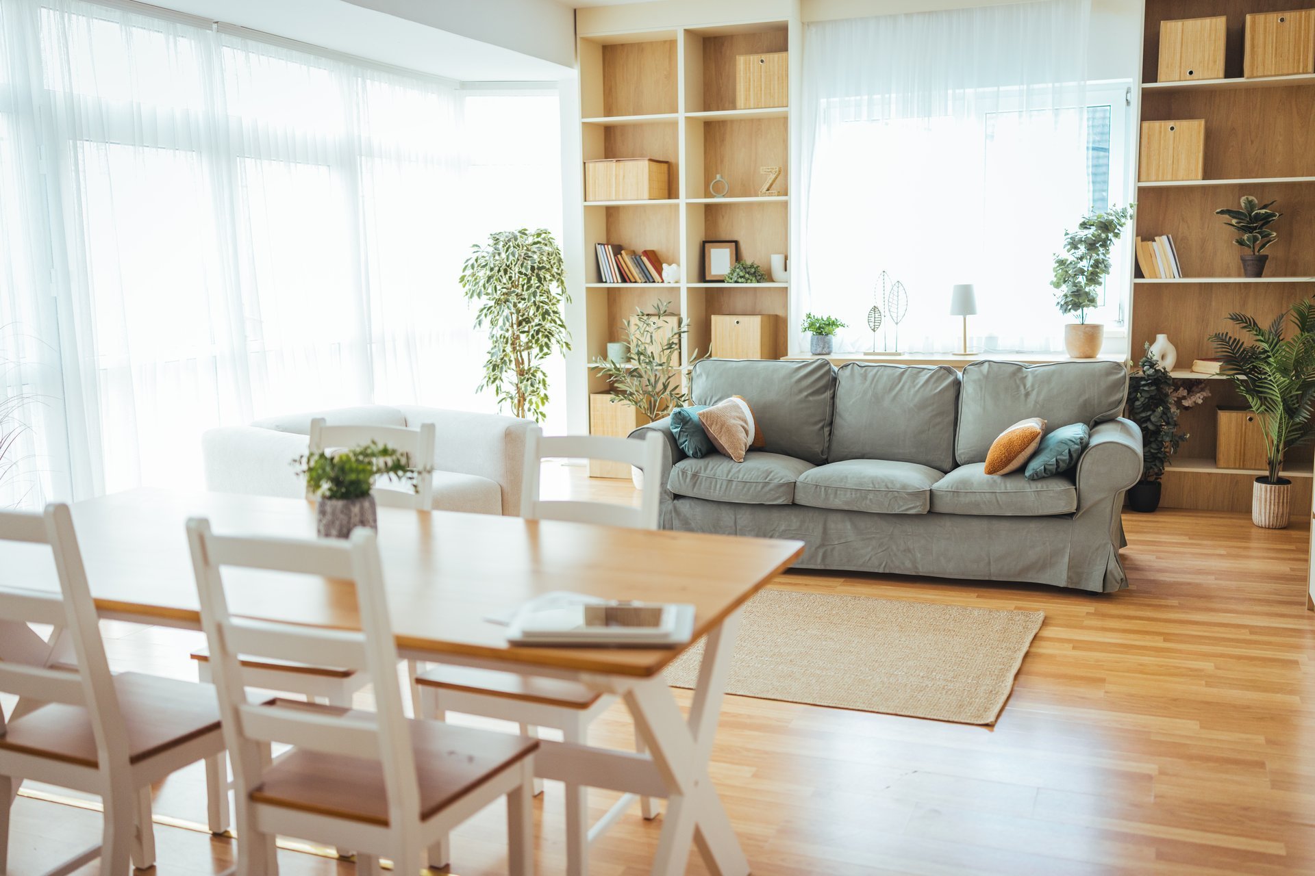 Sunlit open-plan living and dining area of a renovated home