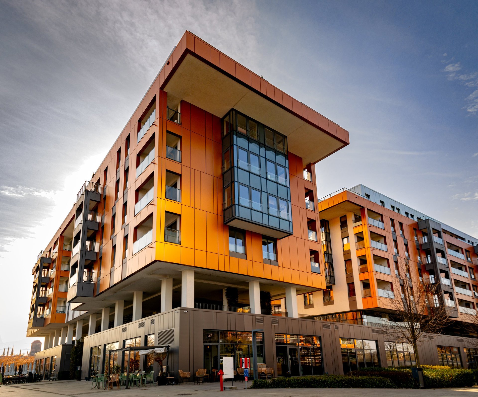 Exterior facade of managed residential buildings with maintained siding and windows