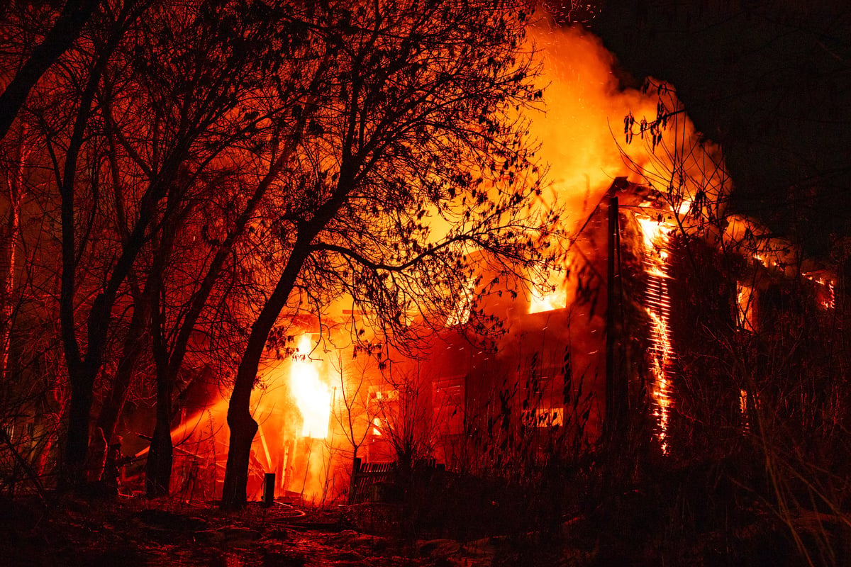 House engulfed in active fire and flames