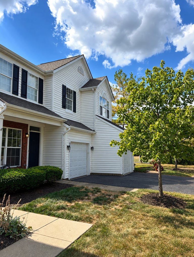 Darby Park community exterior following the 2025 restoration in Hilliard, Ohio, showing white trim and black shutters.